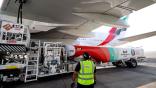 Ground crew prepare an Emirates Airbus A 380-800 aircraft, powering one of its engines with a hundred per cent Sustainable Aviation Fuel 