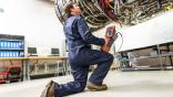 Technician performing a borescope inspection